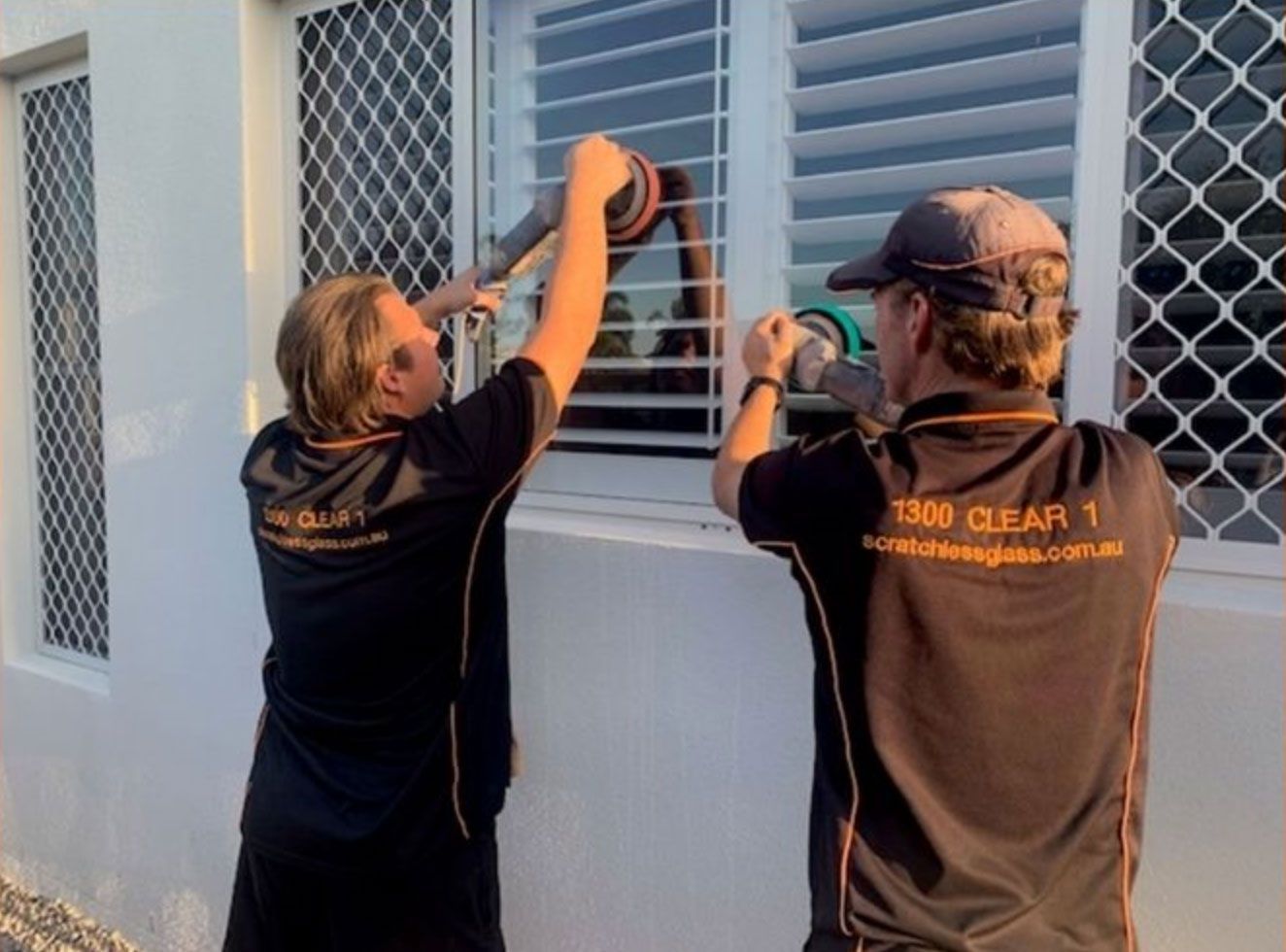 Two Men Wearing Black Shirts Working With Buffing — Scratchless Glass Australia in Maroochydore, QLD