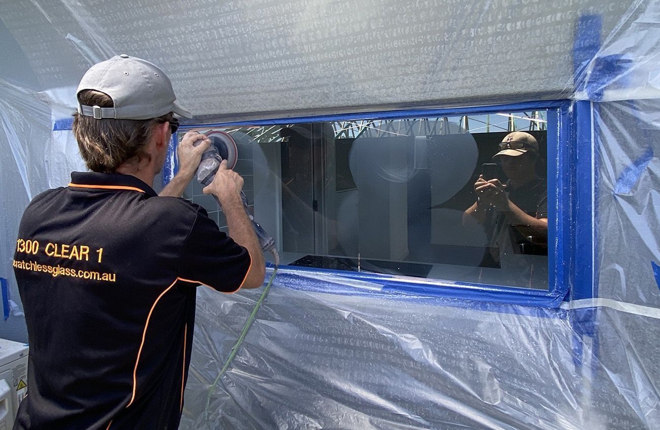 Glass Repair Technician Working On A Window