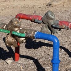 A blue pipe is connected to a red pipe