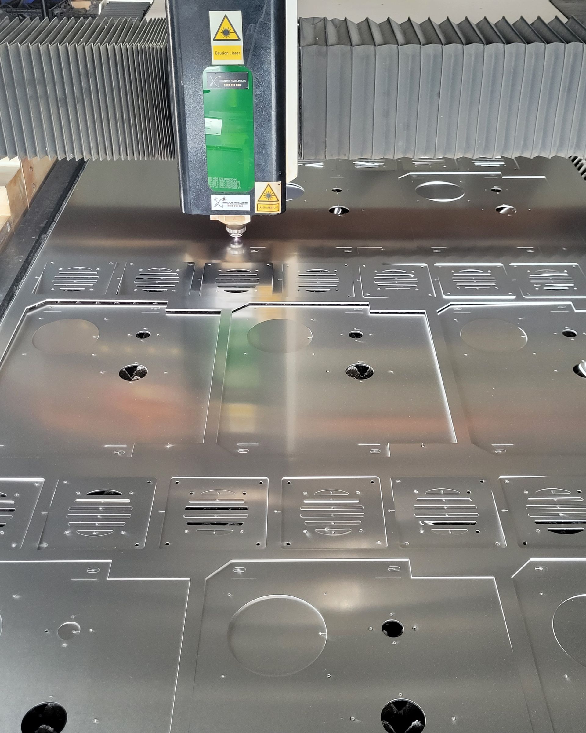 A Machine Is Cutting A Piece For Aluminium Truck Components — Bigdog Welding and Fabrication Pty Ltd In Currajong, QLD
