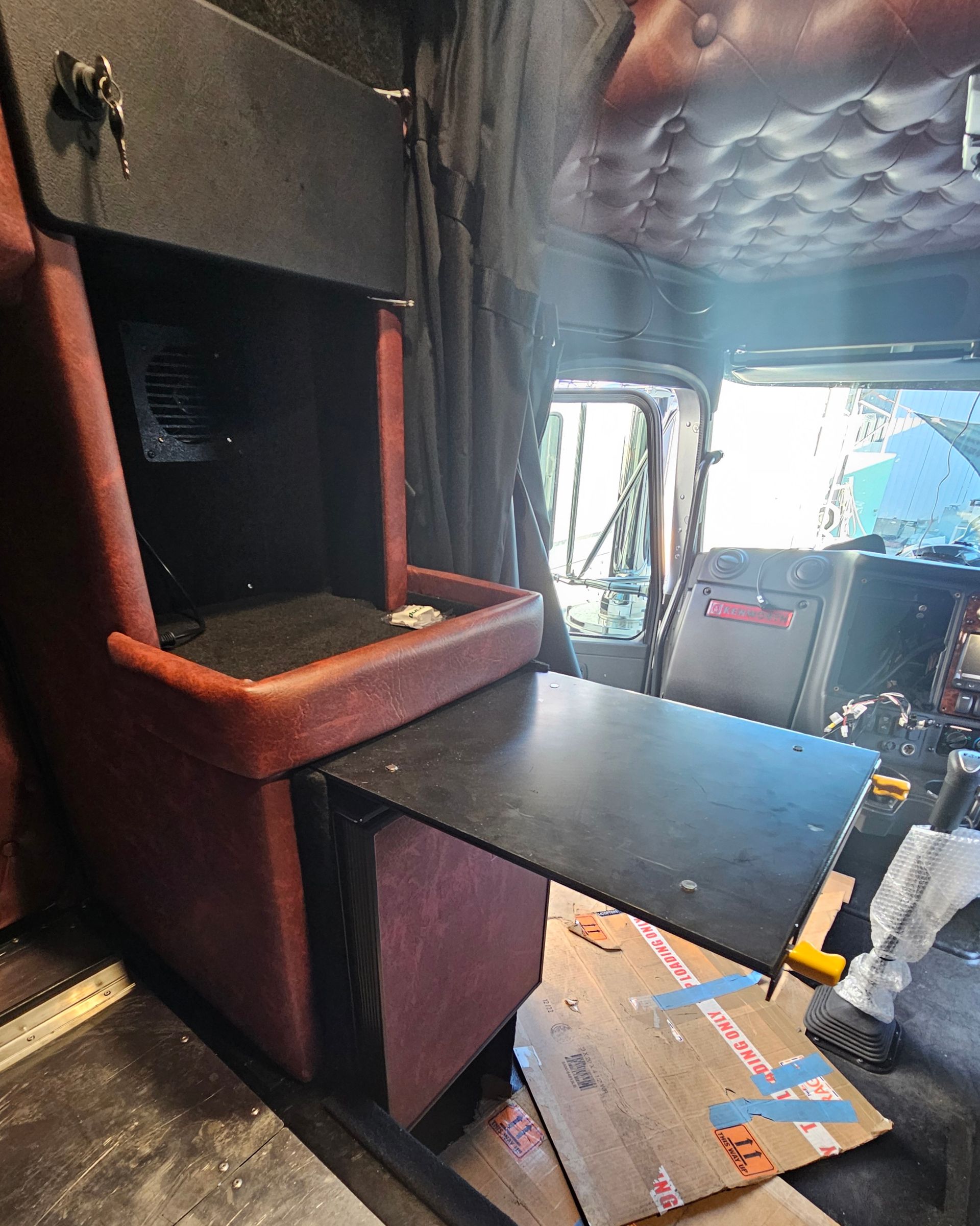 Interior Of A Truck, Showing A Red Cabinet With A Pull-out Table — Bigdog Welding and Fabrication Pty Ltd In Currajong, QLD