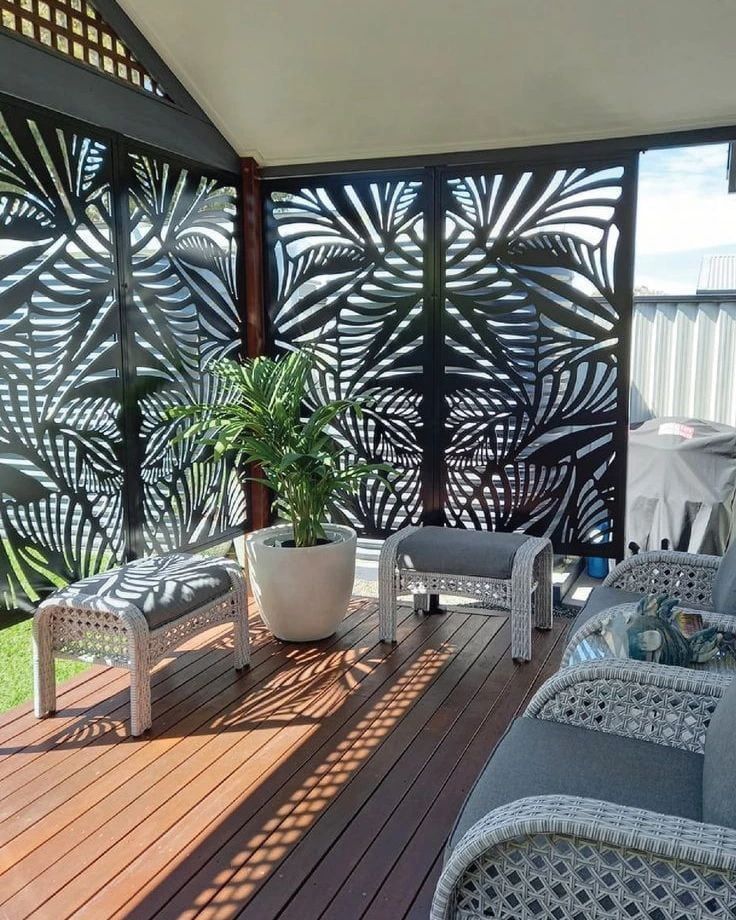 A Patio With Wicker Furniture And A Privacy Panel Behind — Bigdog Welding and Fabrication Pty Ltd In Currajong, QLD