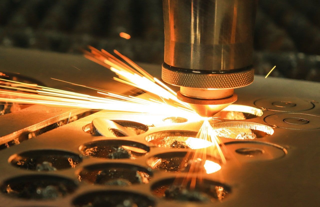 A Machine Is Cutting A Piece Of Metal — Bigdog Welding and Fabrication Pty Ltd In Currajong, QLD