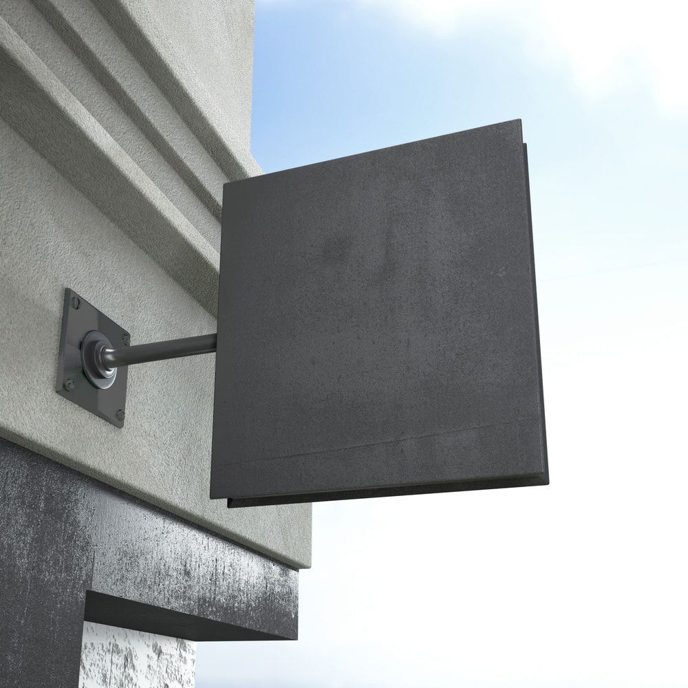 A Black Sign Is Hanging From The Side Of A Building — Bigdog Welding and Fabrication Pty Ltd In Currajong, QLD