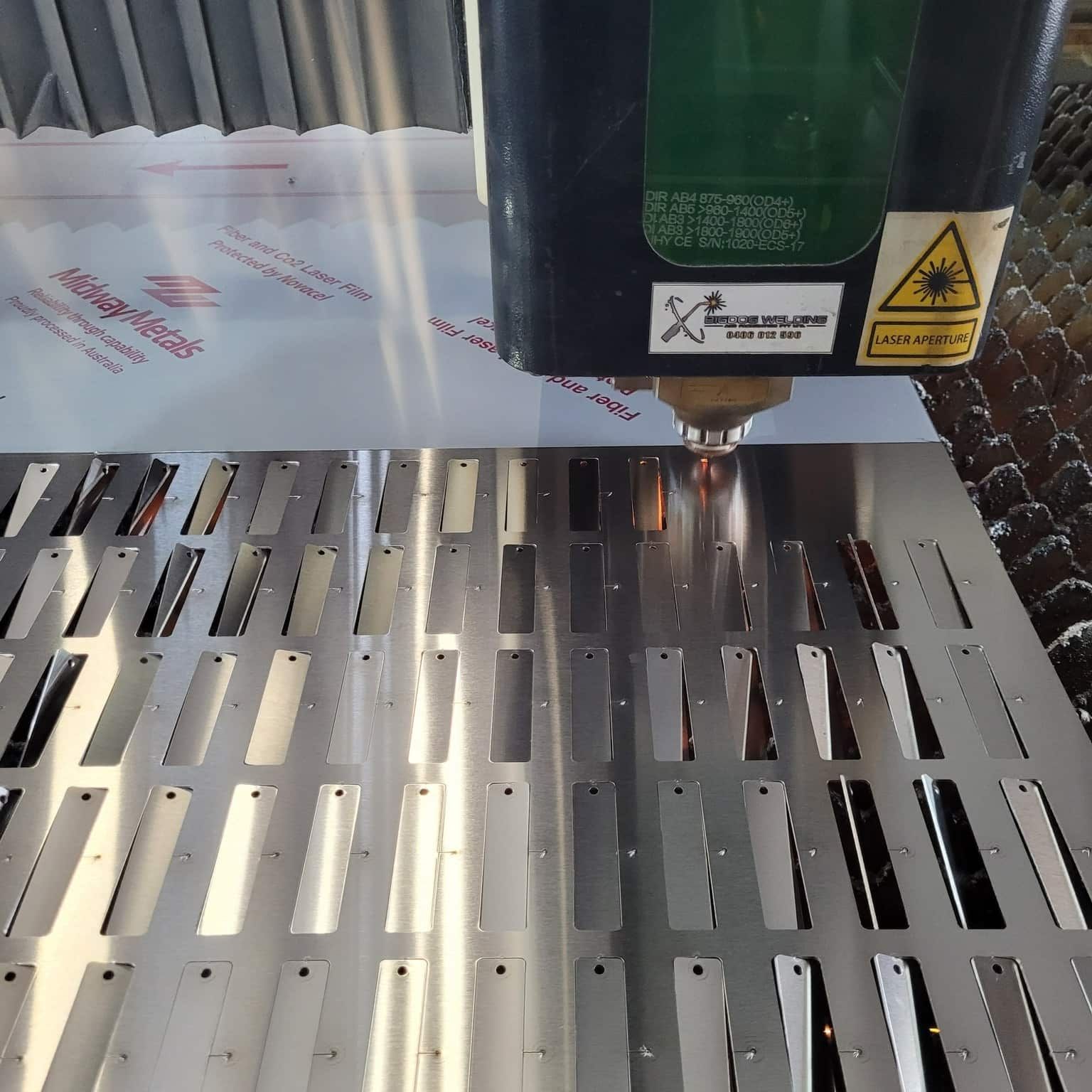 A Laser Cutting Machine Is Cutting A Piece Of Metal — Bigdog Welding and Fabrication Pty Ltd In Currajong, QLD