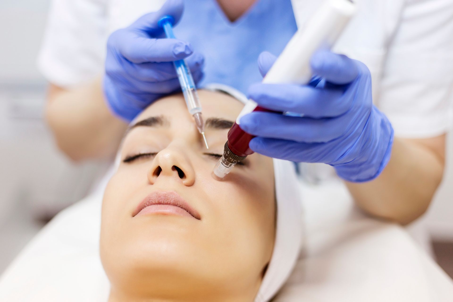 A woman is getting a facial treatment at a beauty salon.