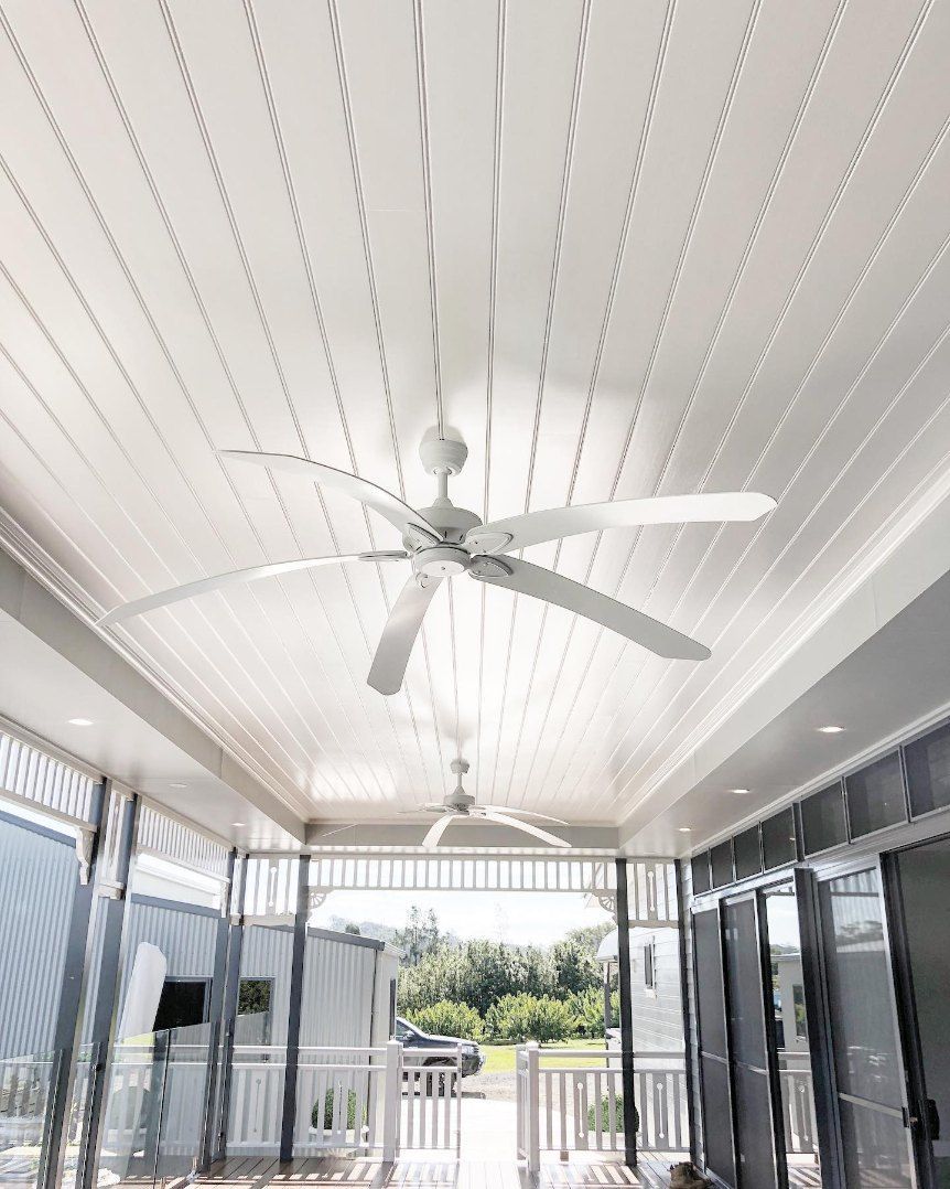 A Ceiling Fan is Hanging From the Ceiling of a Room — Brightway Electrical in Ballina, NSW