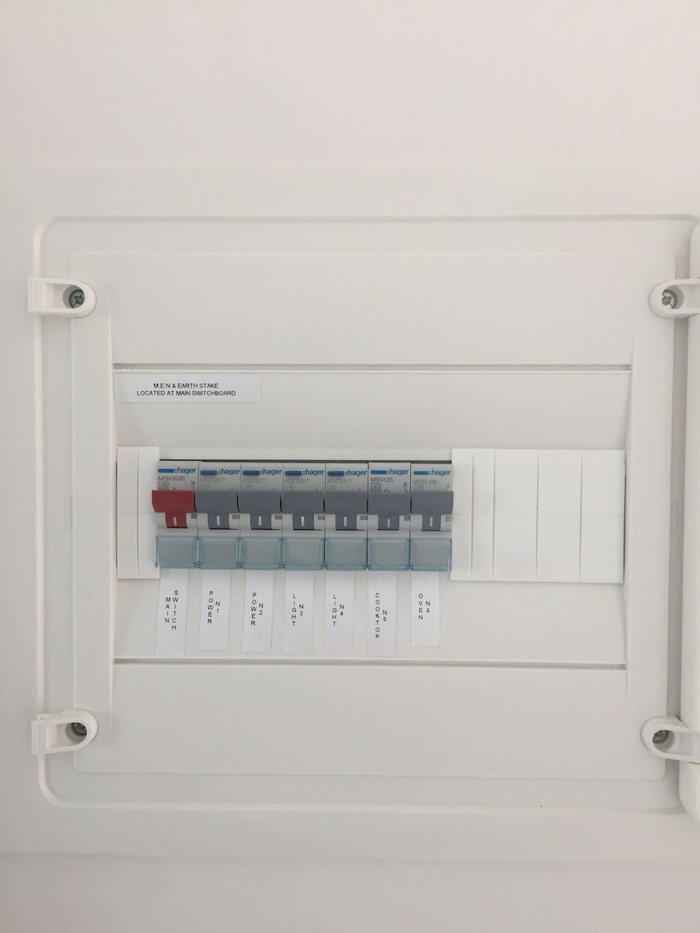 A Small White Switchboard on a Wall — Brightway Electrical in Lennox Head, NSW