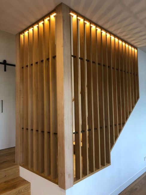 Wooden Slatted Staircase Railing With Warm Lighting — Brightway Electrical in Ballina, NSW