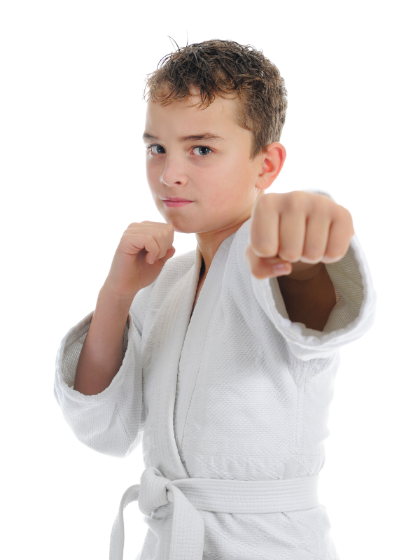 Child in white karate uniform give pose of punching