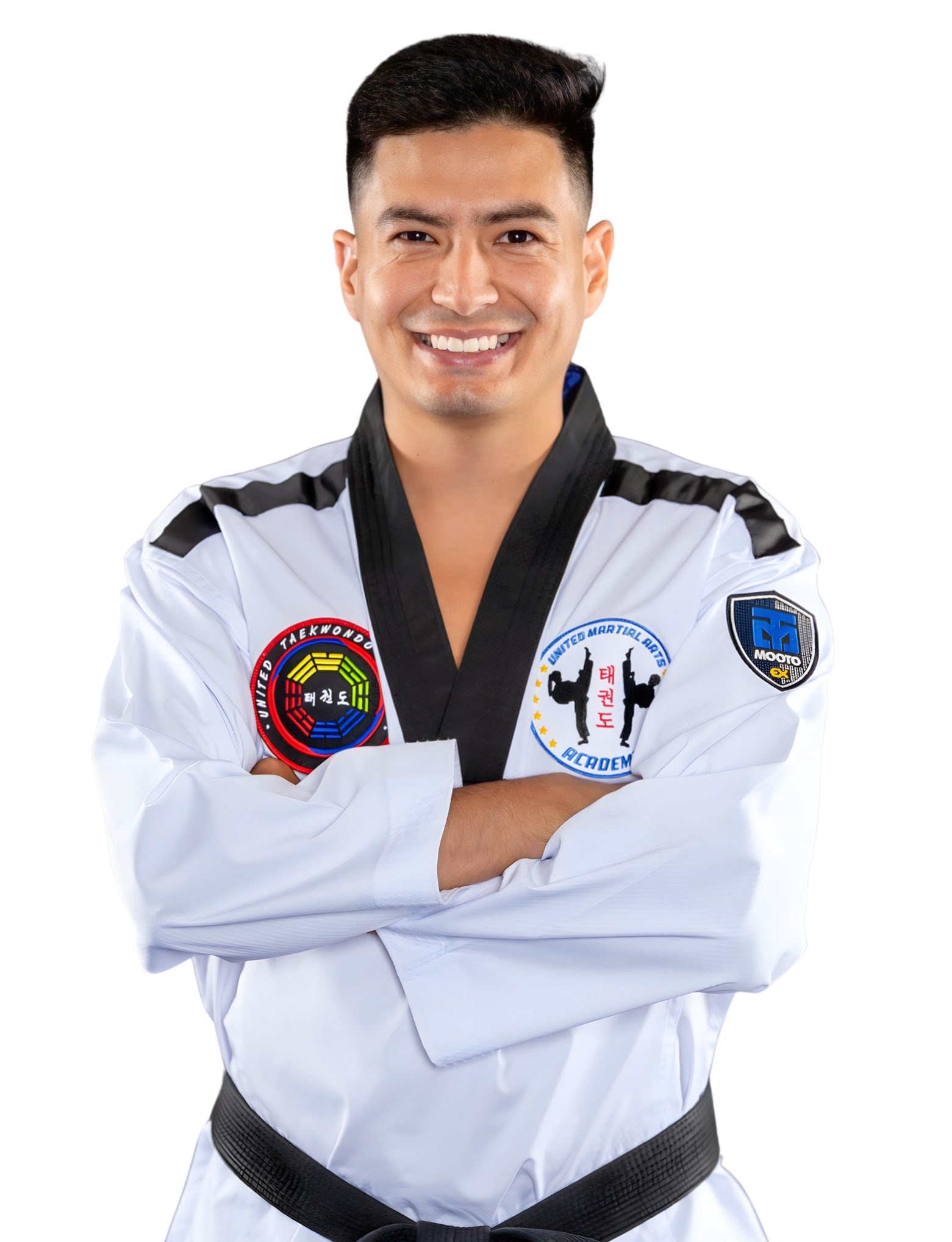 A man in a taekwondo uniform is smiling with his arms crossed.