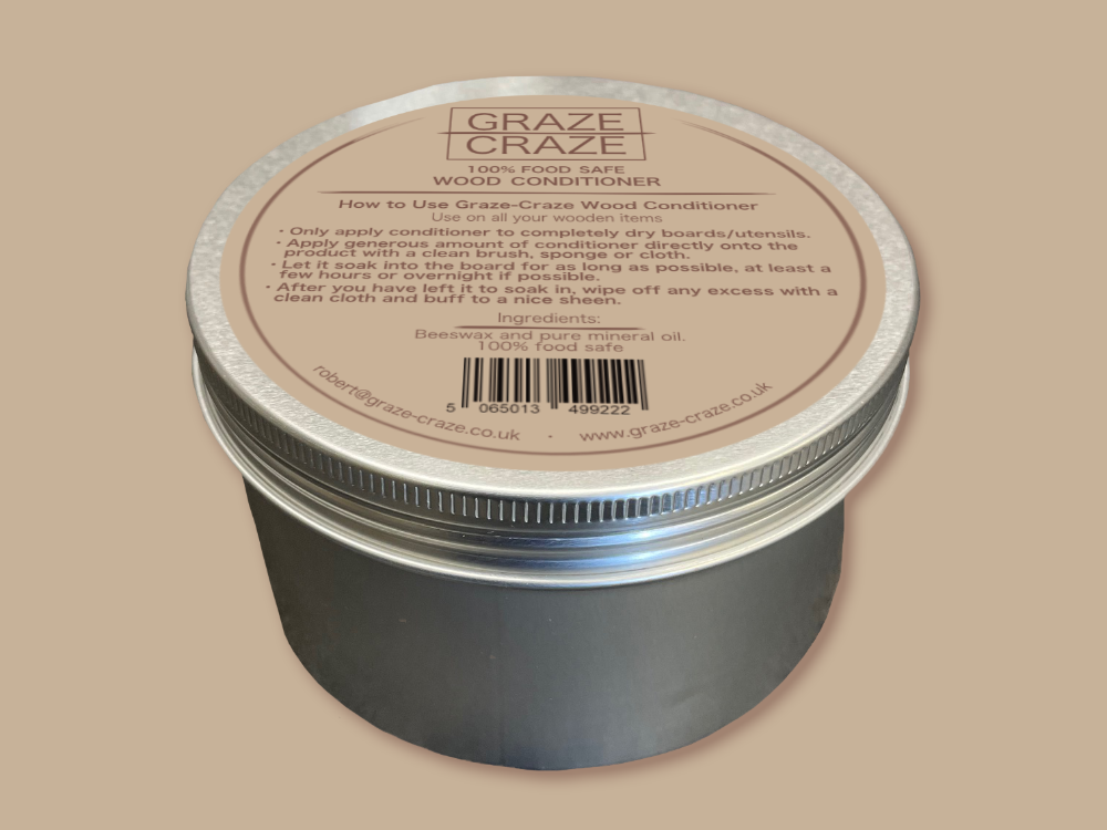 A can of graze craze wood conditioner sitting on a beige background.