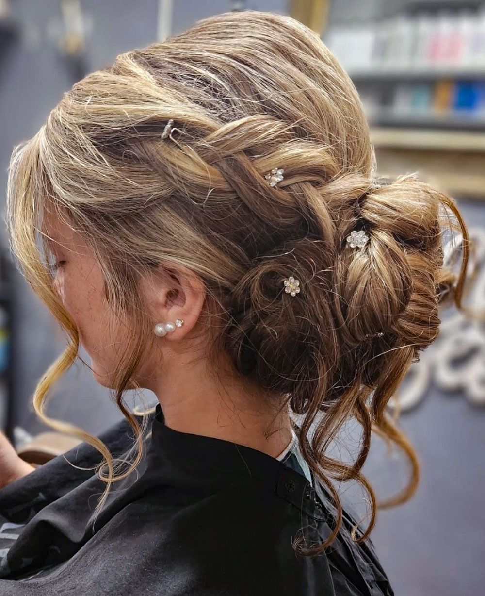 A woman with blue eyes is kneeling down and looking at the camera