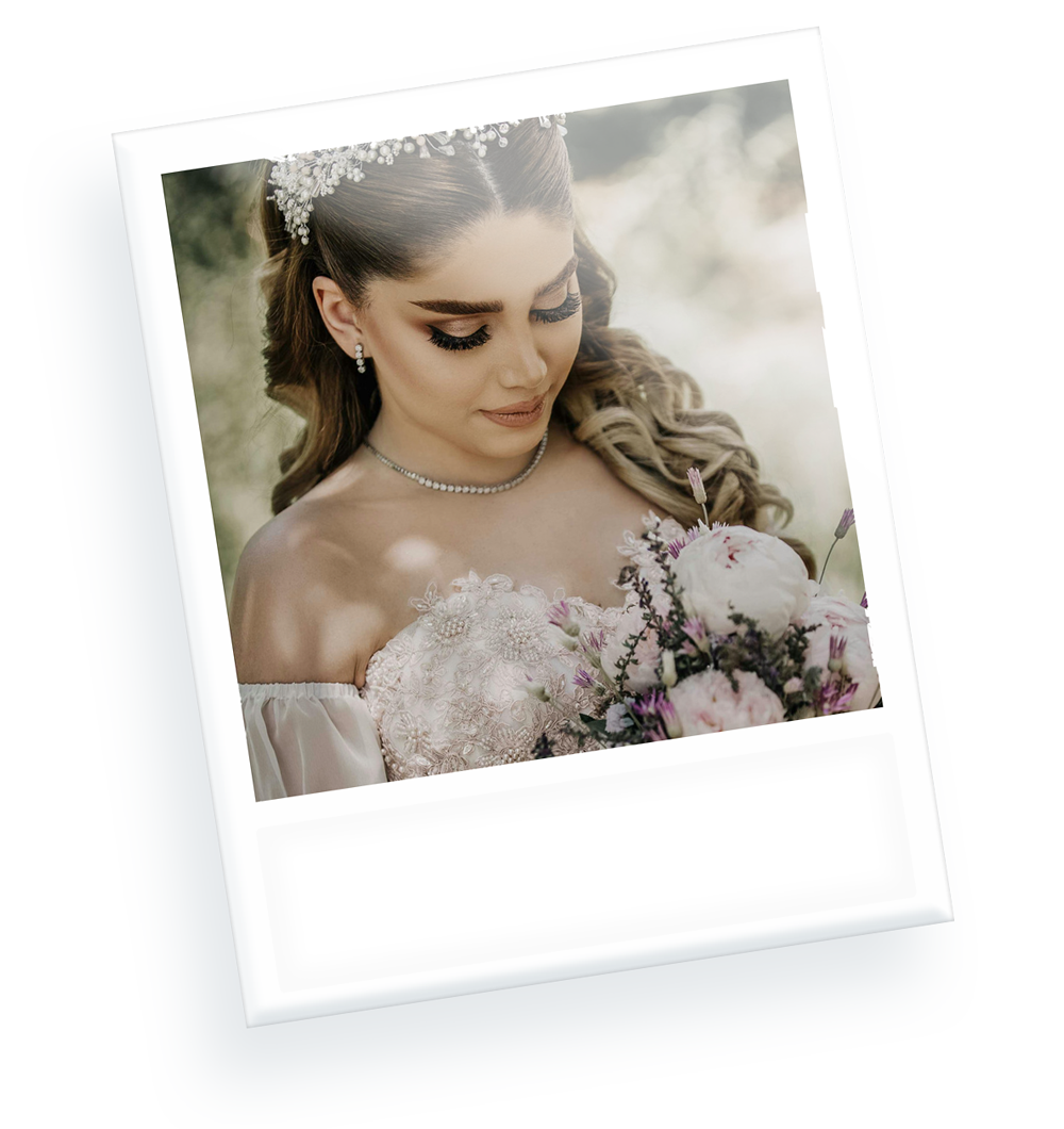 A woman in a wedding dress is holding a bouquet of flowers.