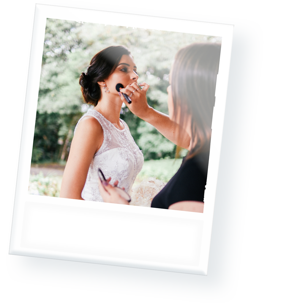 A woman is applying makeup to another woman 's face