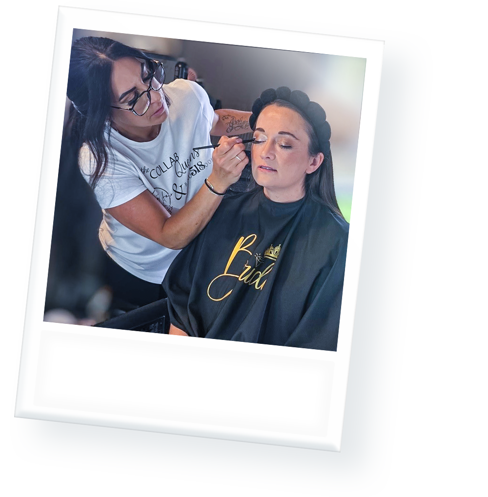 A woman is applying makeup to another woman 's face