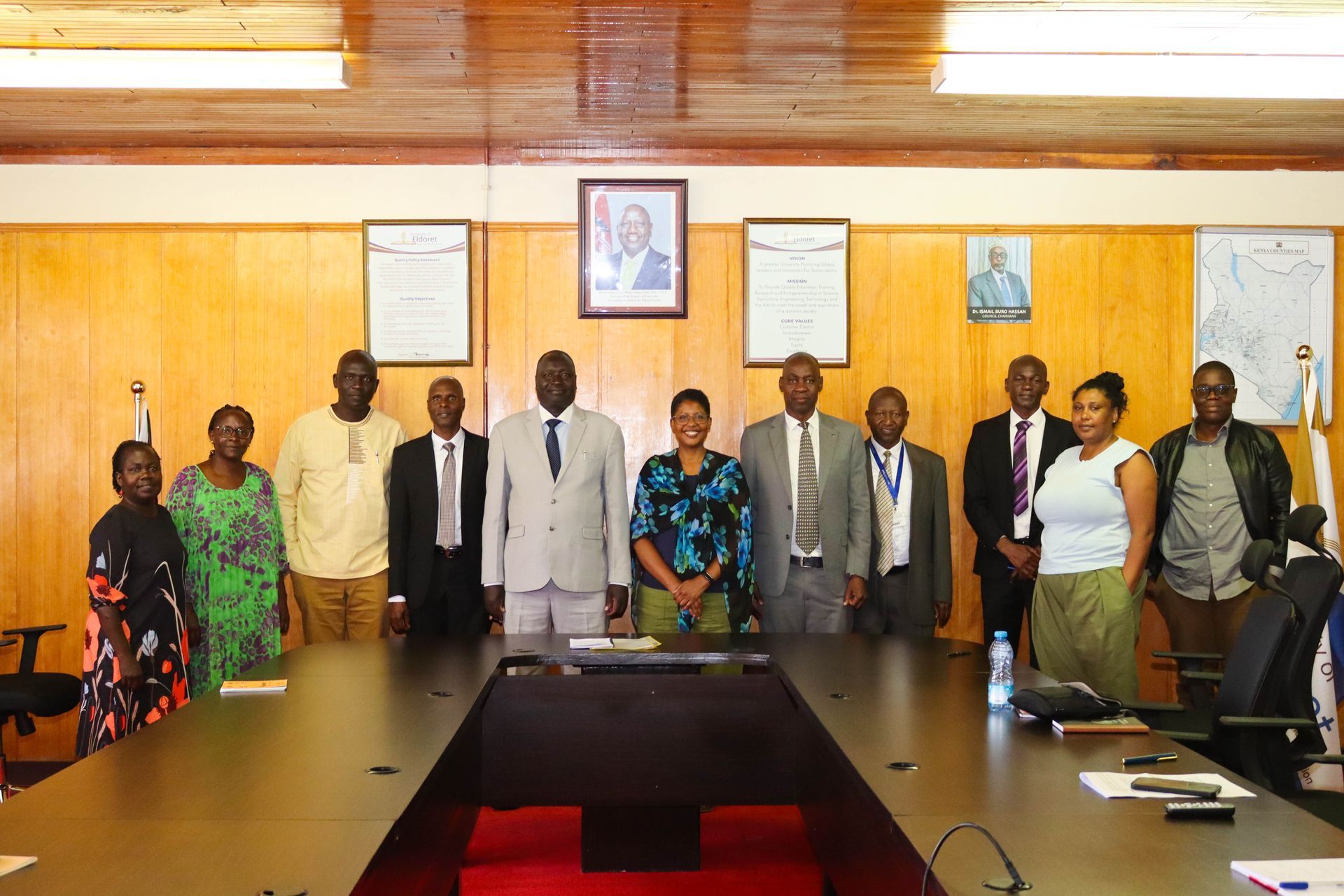 Person giving a presentation to a seated audience in a multi-level atrium.  Discovering Africa in the classroom