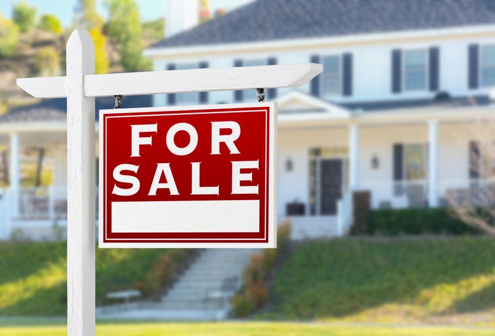 For Sale Sign in Front of a White House With a Porch and Green Lawn — Diamond Real Estate QLD in Deception Bay, QLD