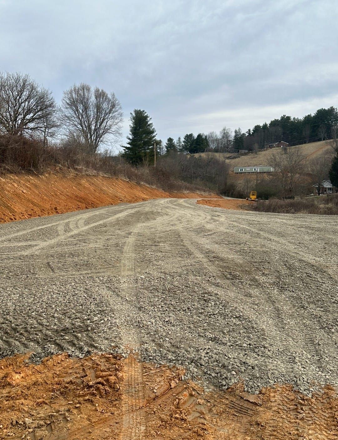 A dirt road going with trees in the background - Alexander, NC - Land Solutions, LLC
