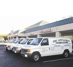 Home Appliance Repairs — White Service Cars In The Parking Lot in Edgewater, MD