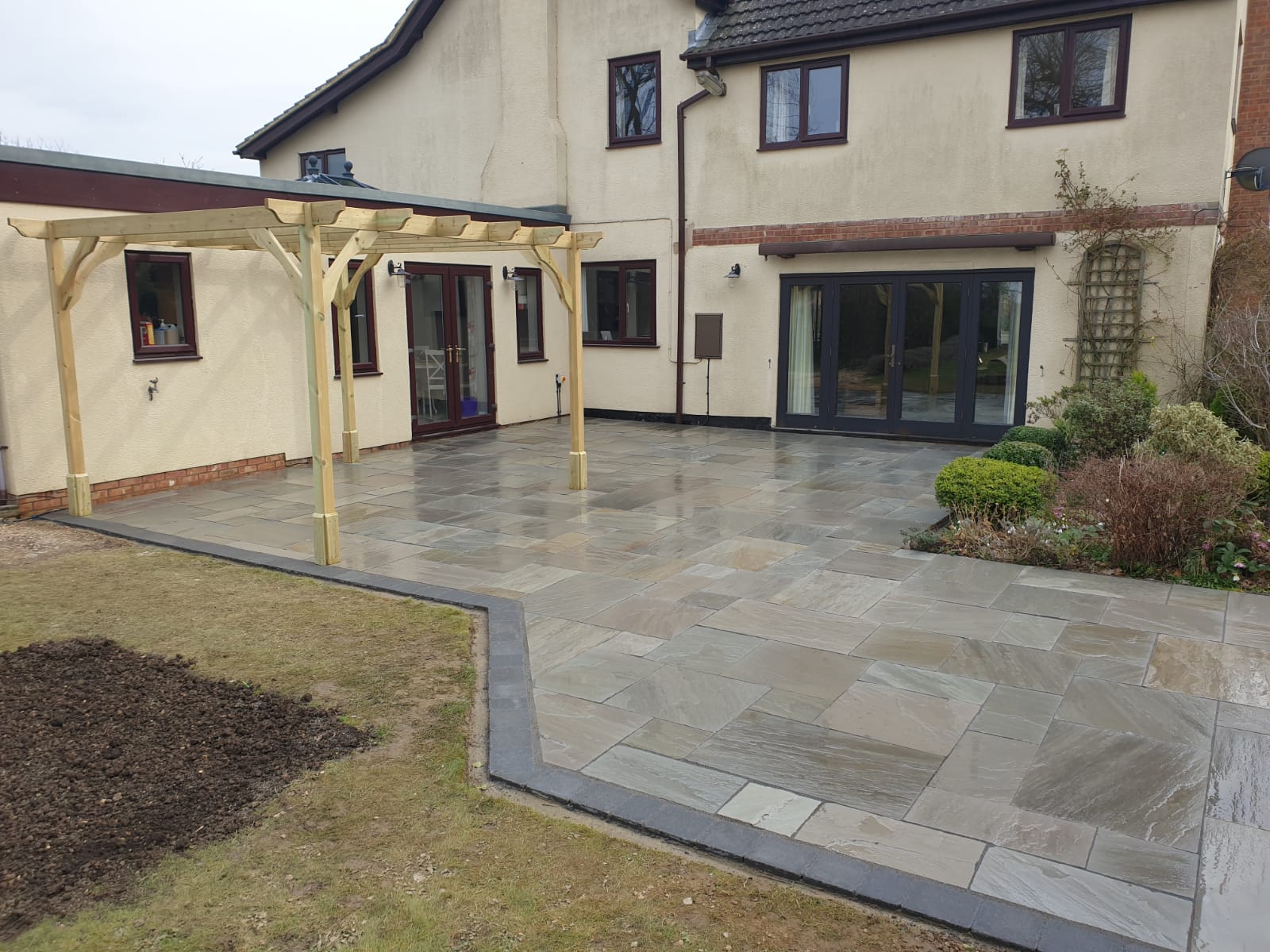 paved areas leading to a garden with fencing