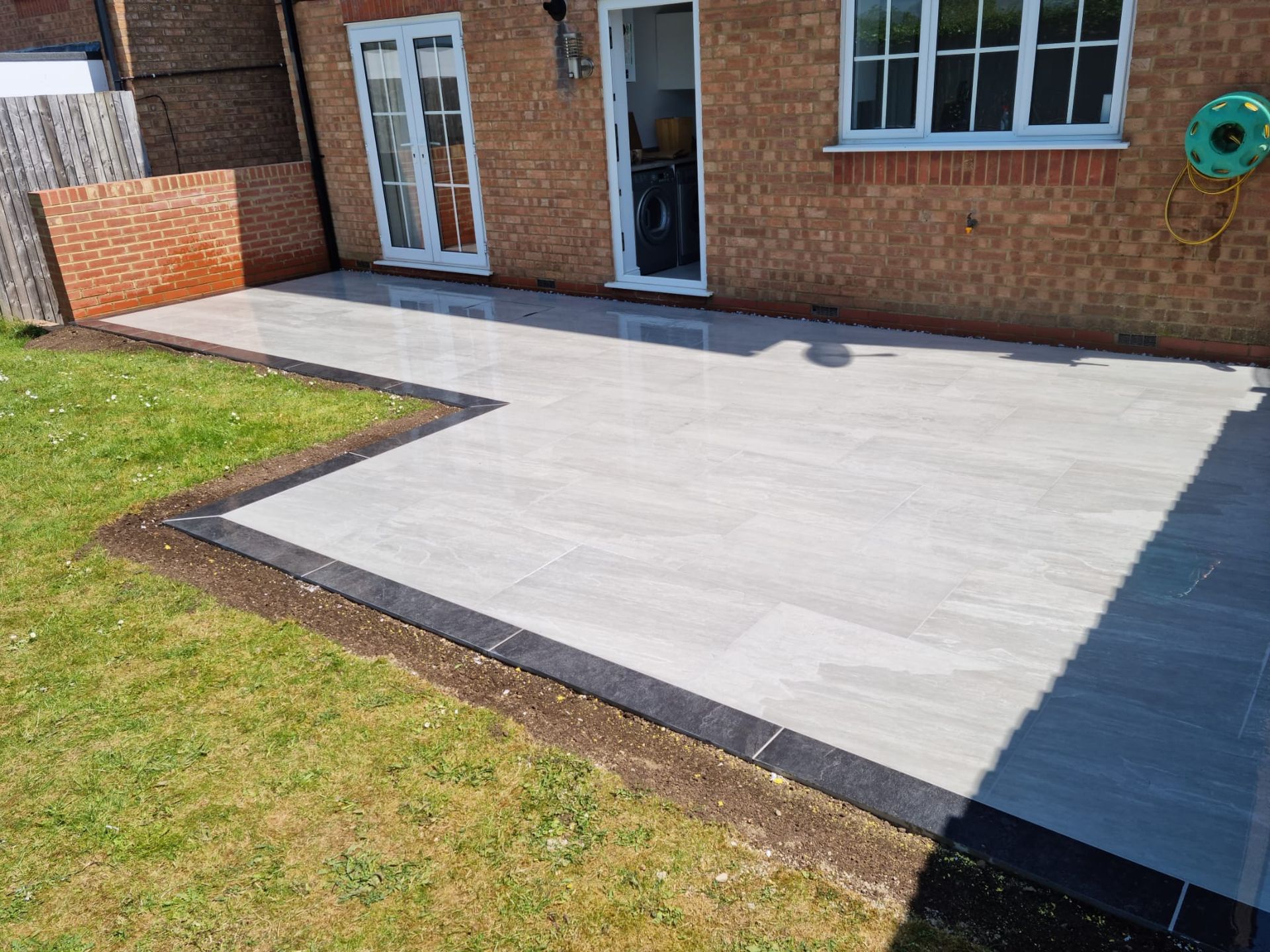 paving and fencing in a back garden