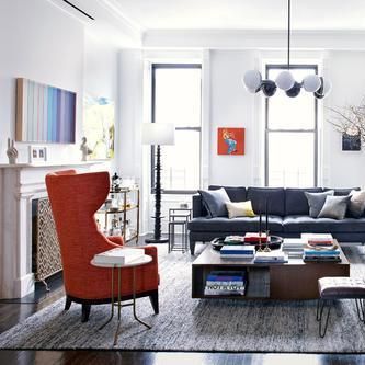 A living room with a couch a chair and a coffee table