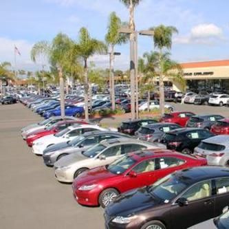 A lot of cars are parked in a parking lot