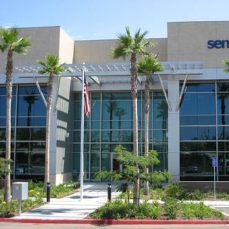 A large building with palm trees in front of it