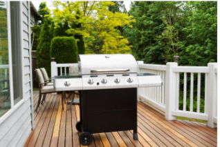 Grill  on porch with wooden deck in Cheyenne