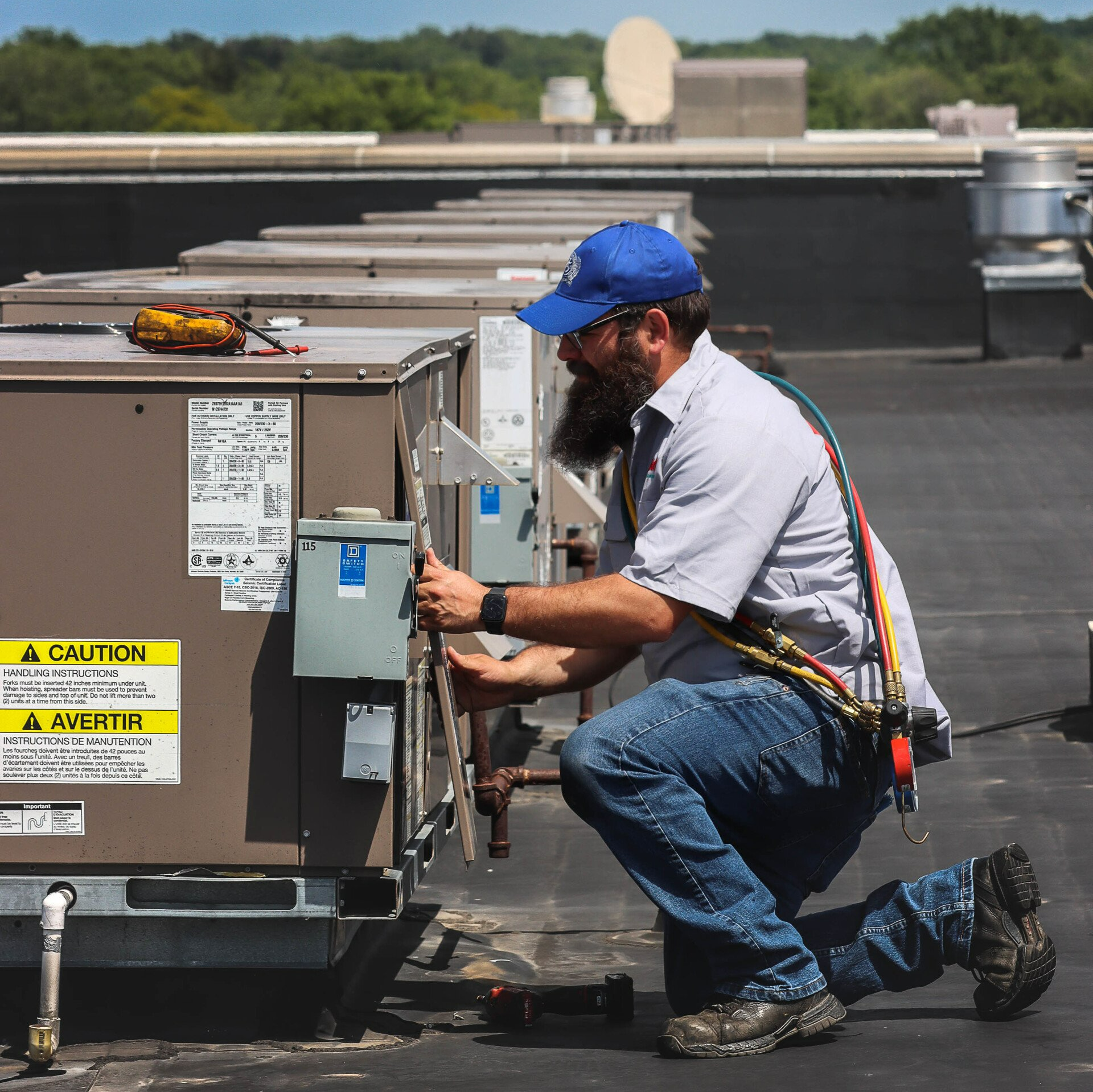 Technician Fixing Air Conditioner Process — Woodstock, IL — Jensen’s Plumbing & HVAC