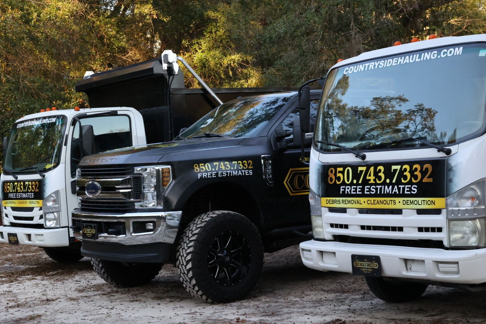 A dump truck is parked in front of a building.