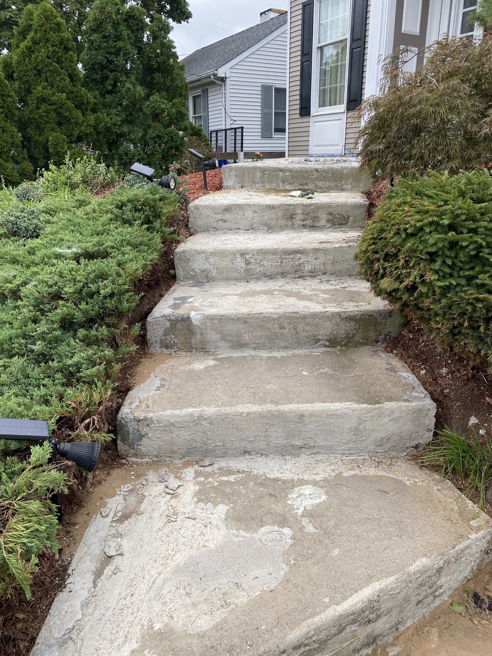 Before image of a curved residential stairway — New Jersey — Konkreate & Epoxy