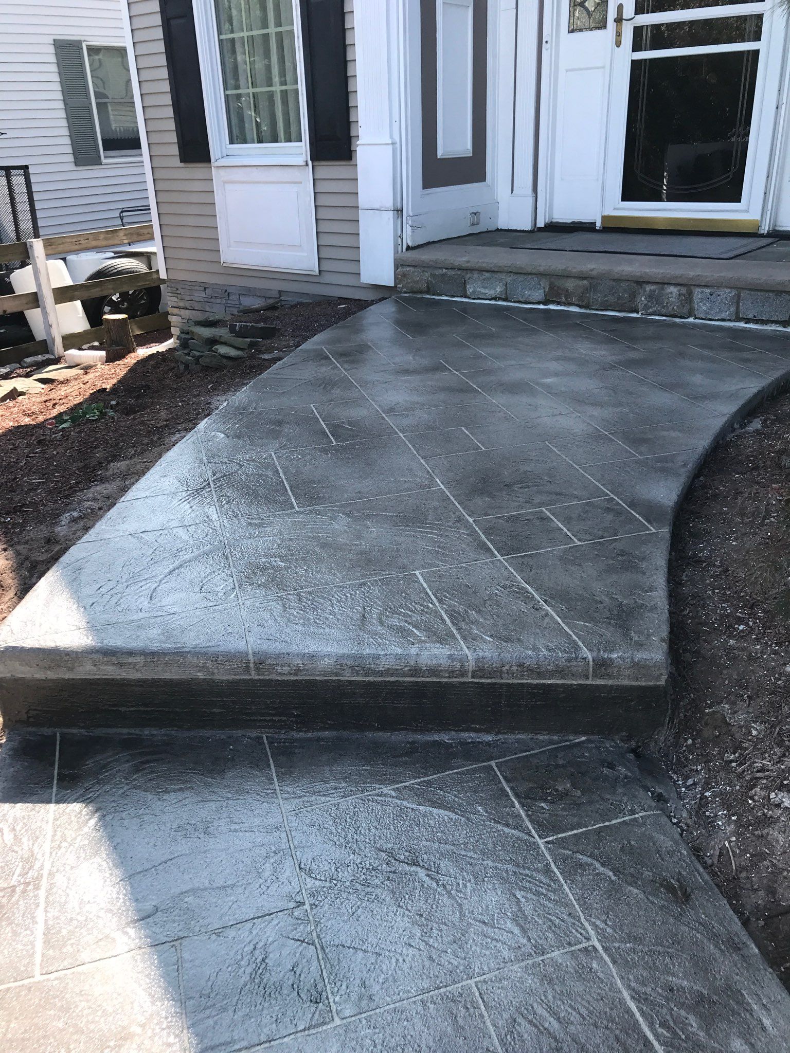 Curved residential stairway with nice floor decoration — New Jersey — Konkreate & Epoxy