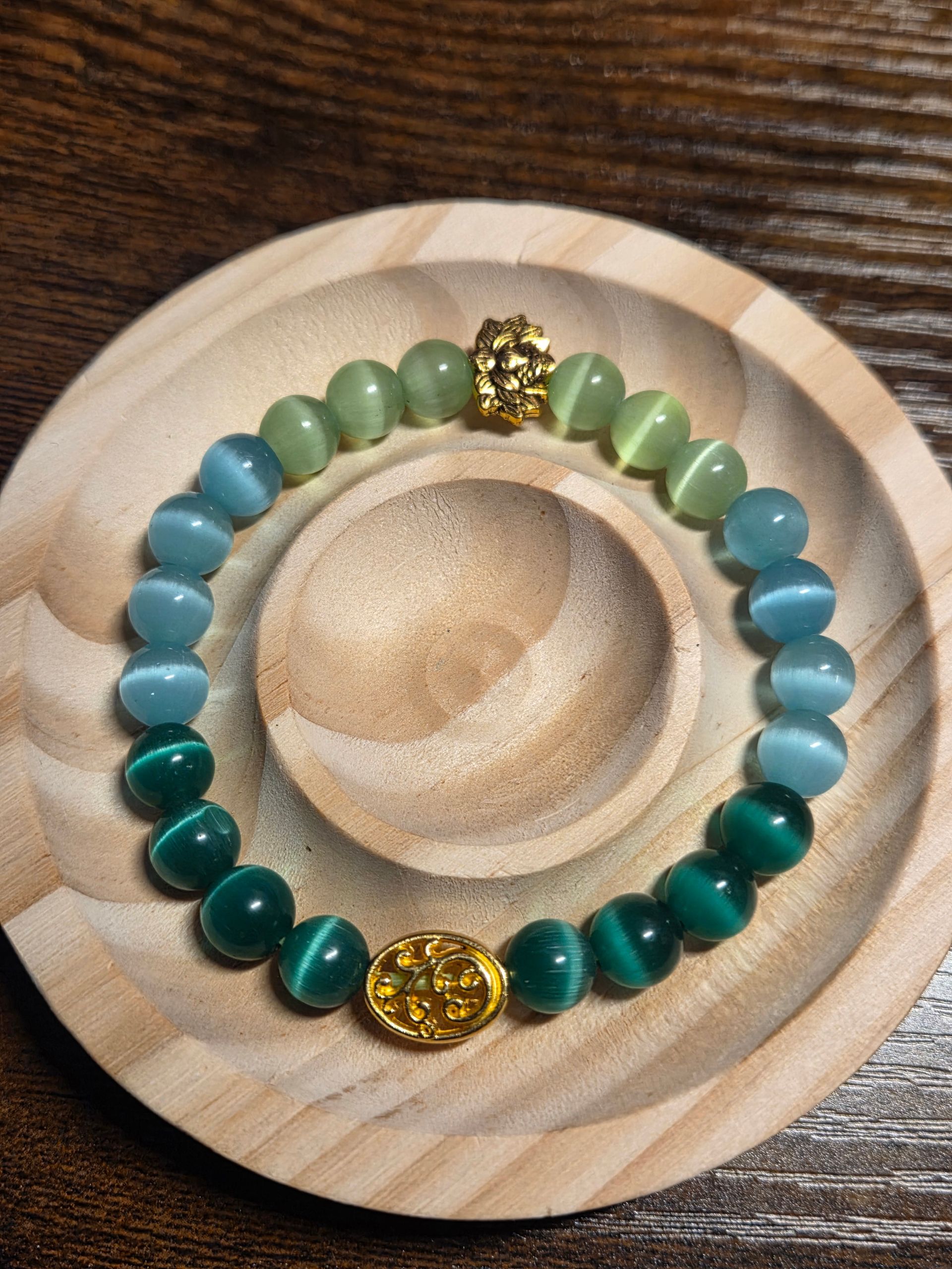 Blue, Green, and Lime Green Cat's Eye with a floral and lotus spacer