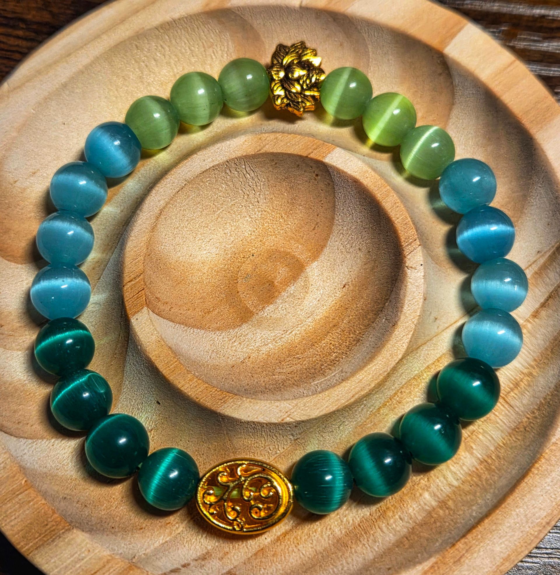 Blue, Green, and Lime Green Cat's Eye with a floral and lotus spacer