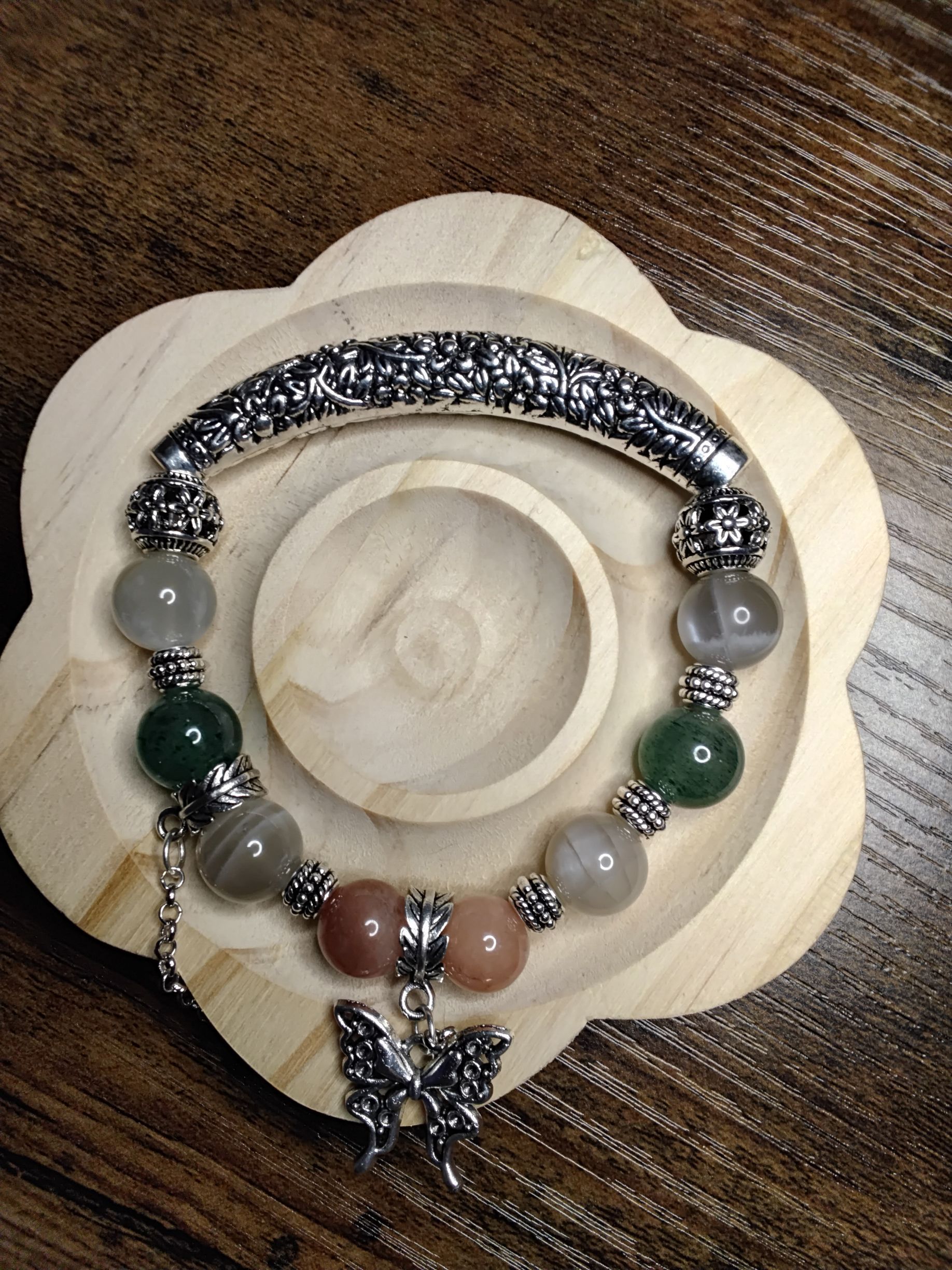Half Metal Bangle with Gray Moonstone, Sunstone, Green Strawberry Quartz with a Butterfly Dangle