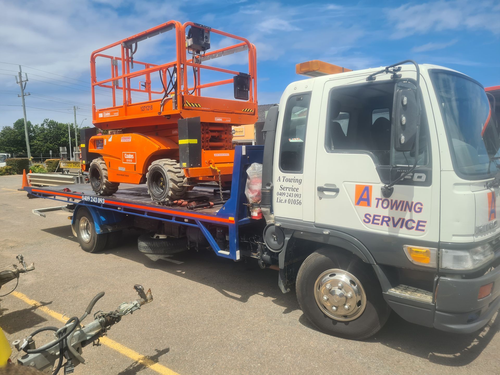A towing service truck is carrying a lift on the back of it. — A Towing Service In Forster, NSW