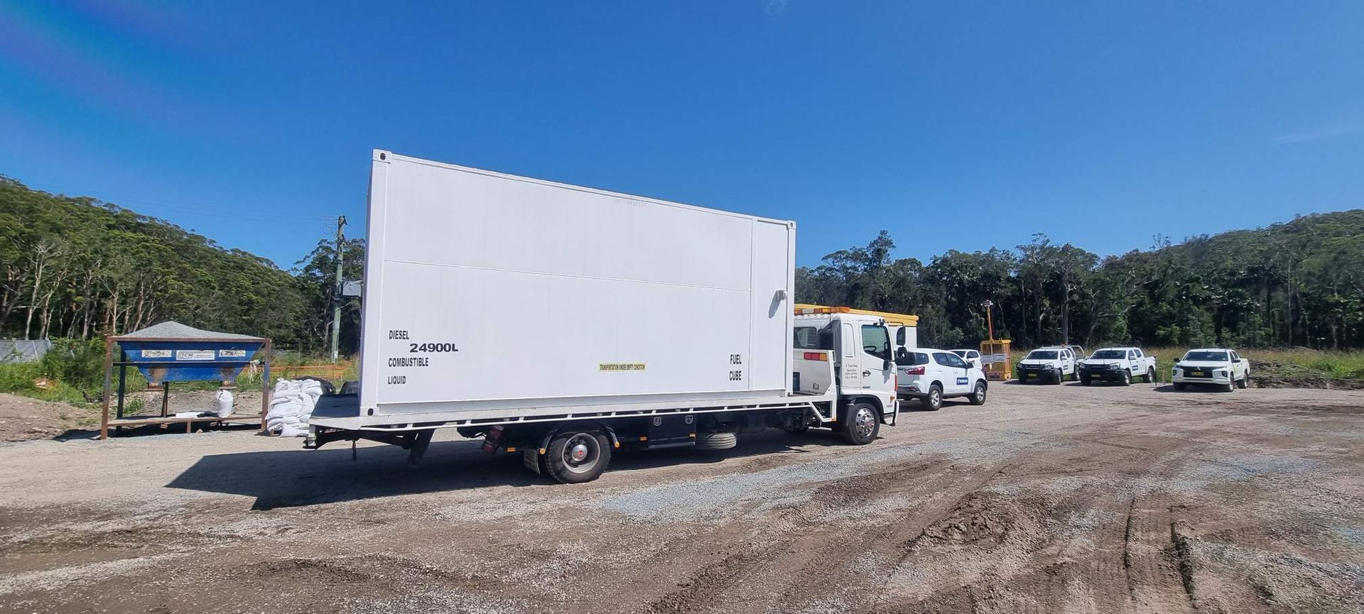 A white truck is parked in a dirt lot. — A Towing Service In Forster, NSW