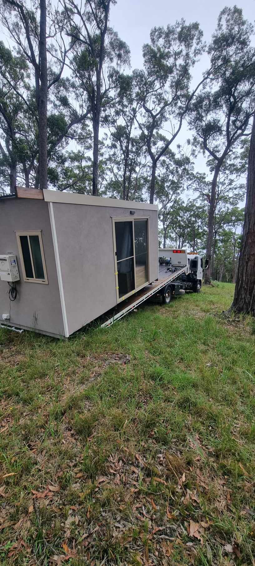 Small, Angular Building Being Transported on a Truck — A Towing Service In Smiths Lake, NSW