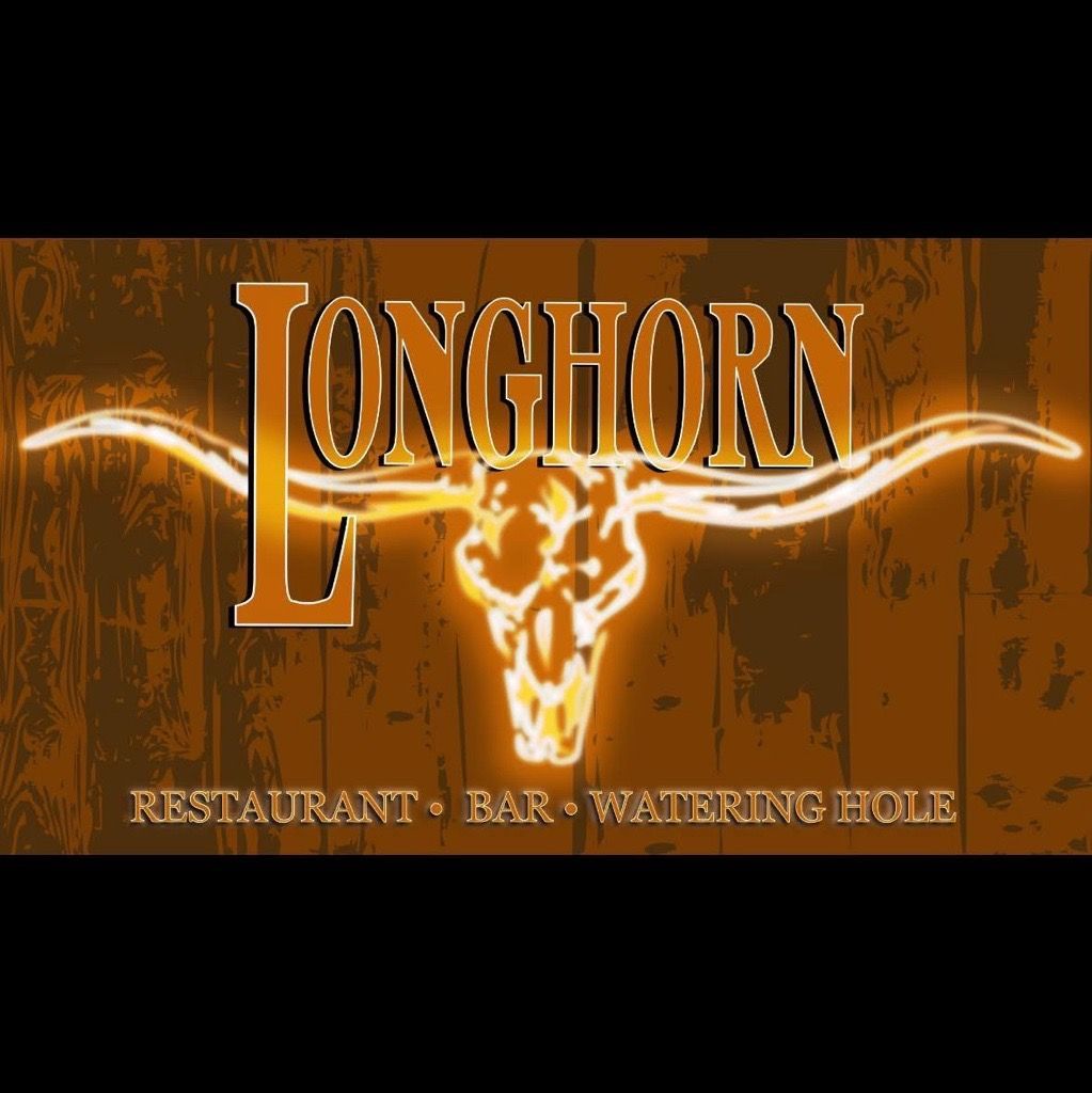 The front of a wooden cabin with stairs leading up to it.