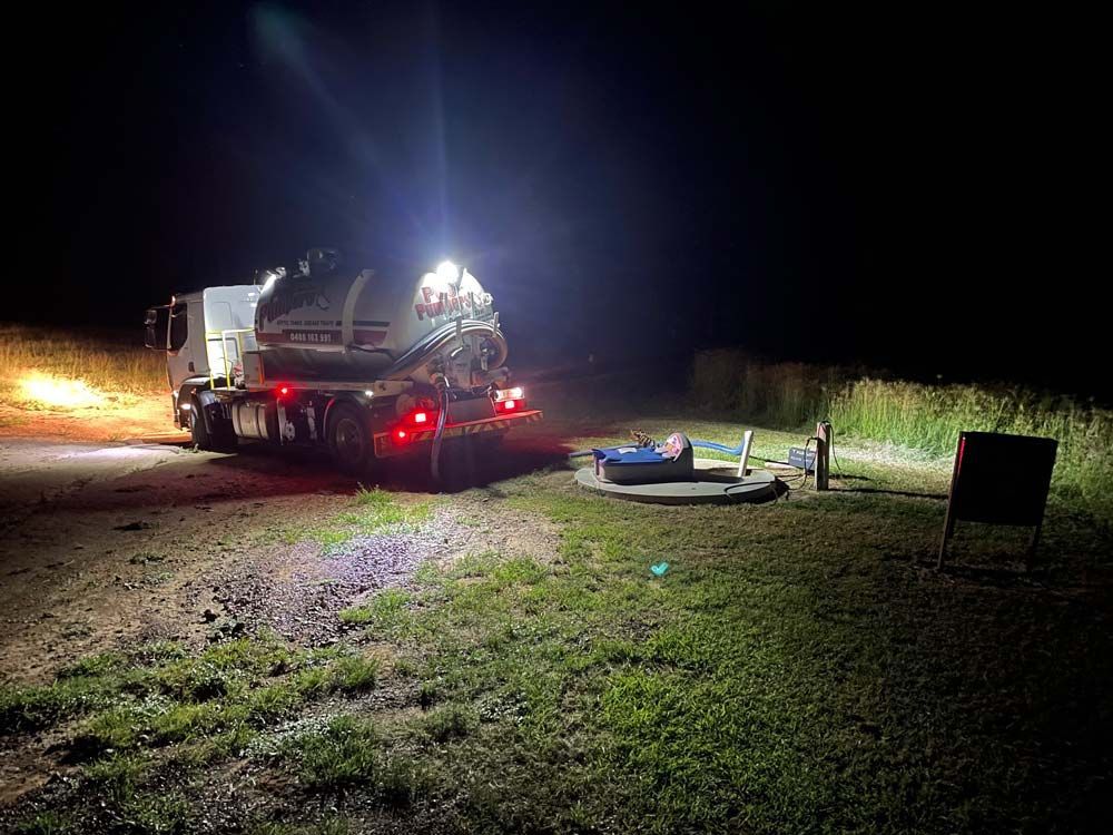 A Truck Doing Pump Out The Septic Tank At Night — Gympie Poo Pumpers in Monkland, QLD