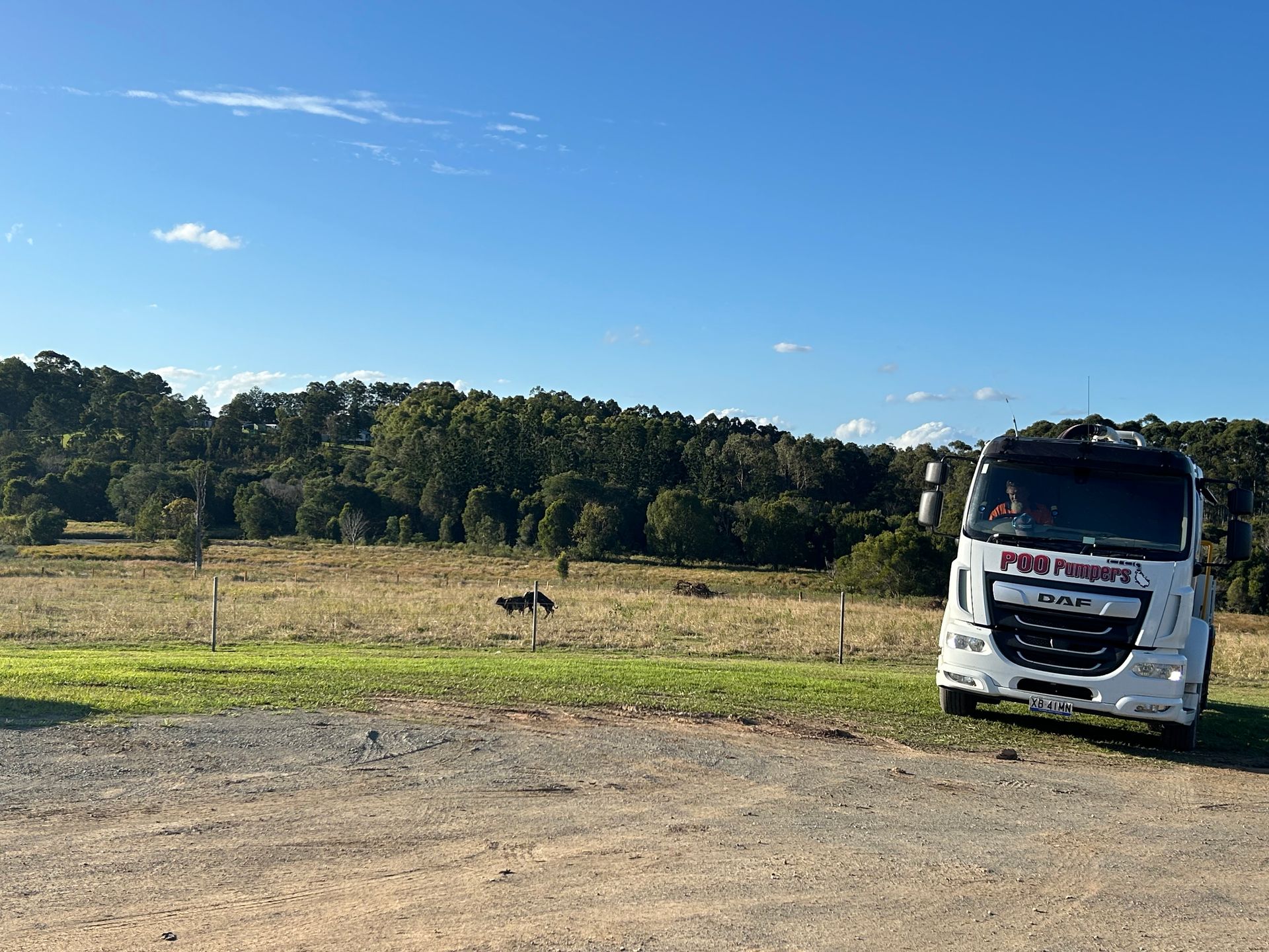 A Septic Tank Truck On A Field— Gympie Poo Pumpers in Chatsworth, QLD