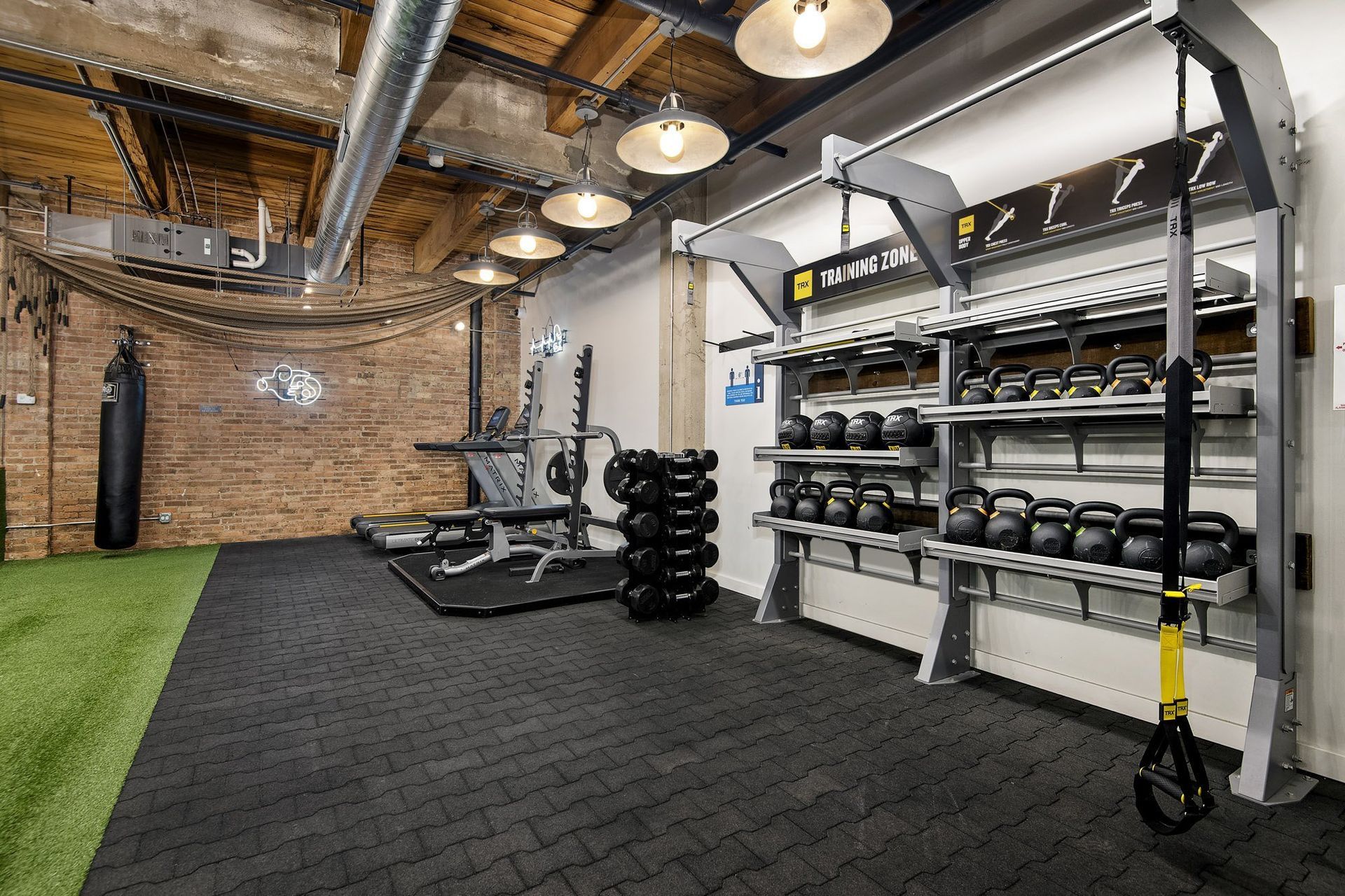 a gym with weights and a weights rack