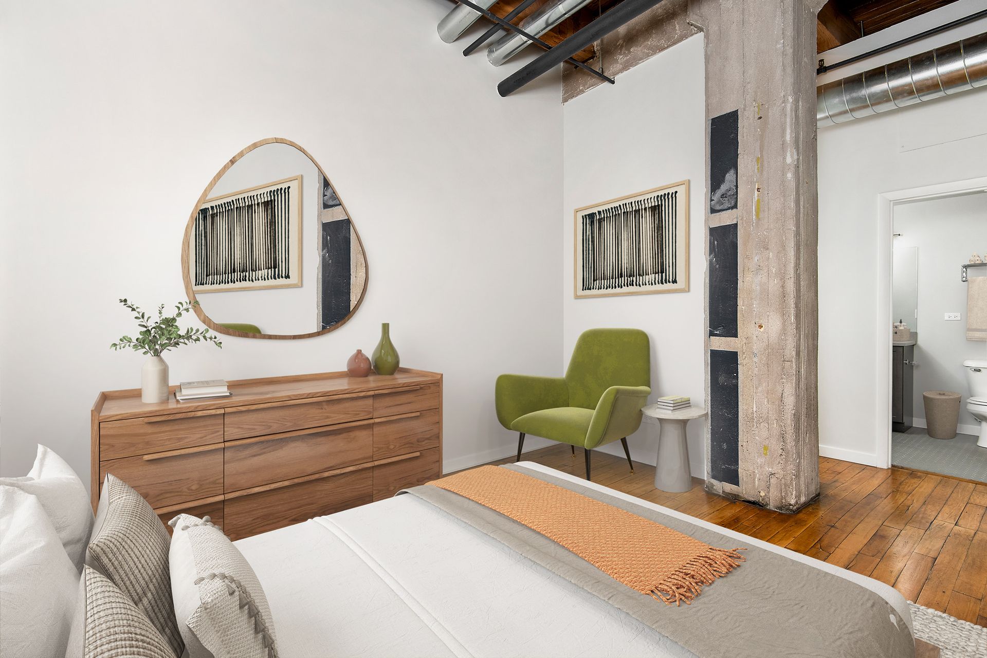 A bedroom with a bed , dresser , chair and mirror at The Lofts at Gin Alley.