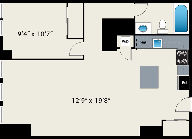 A floor plan of a small apartment with a bathroom and kitchen at The Lofts at Gin Alley.