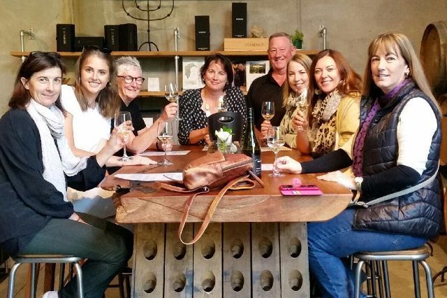 A group of ladies enjoying a premium wine tasting at Trinity Hill Winery, Hawkes Bay NZ