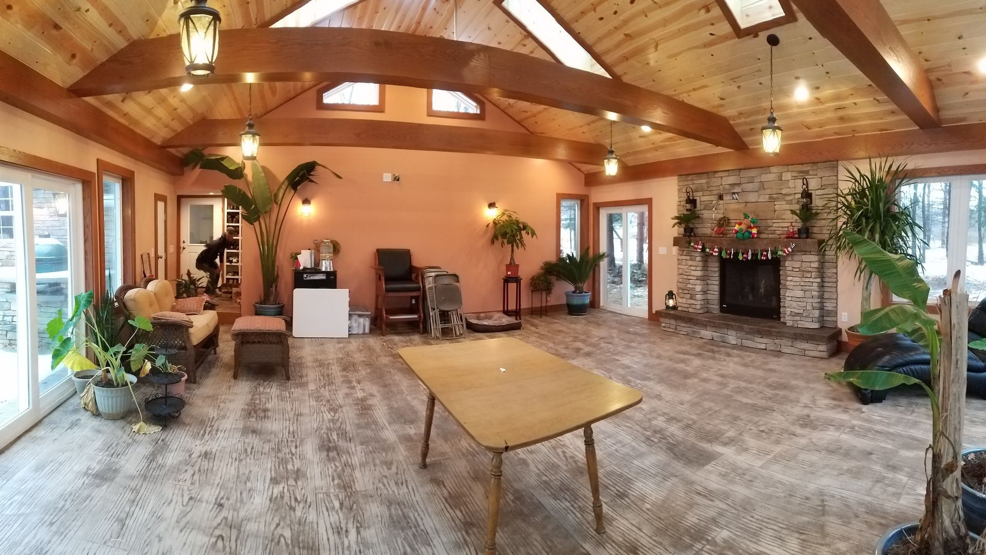 A large room with a table and chairs in it