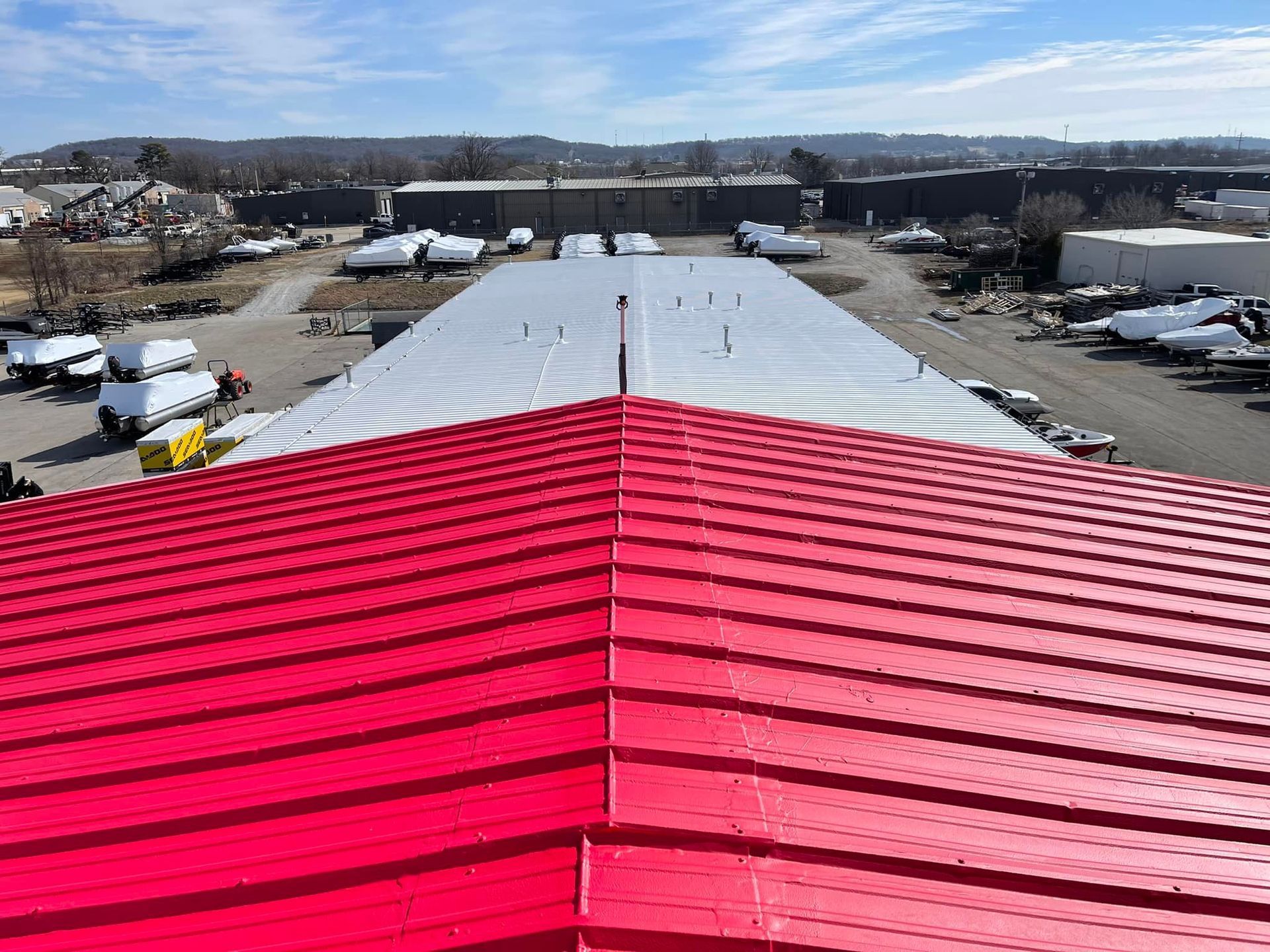 The roof of a building with a red roof and a white roof.