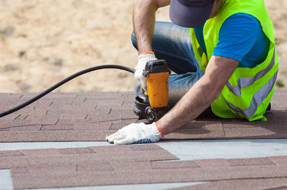 man working on roof